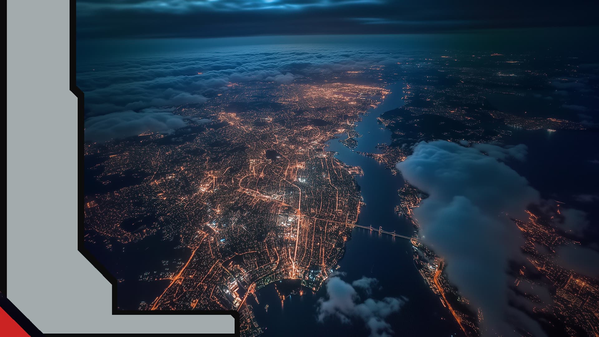 Aerial night view of illuminated city with river and cloud cover